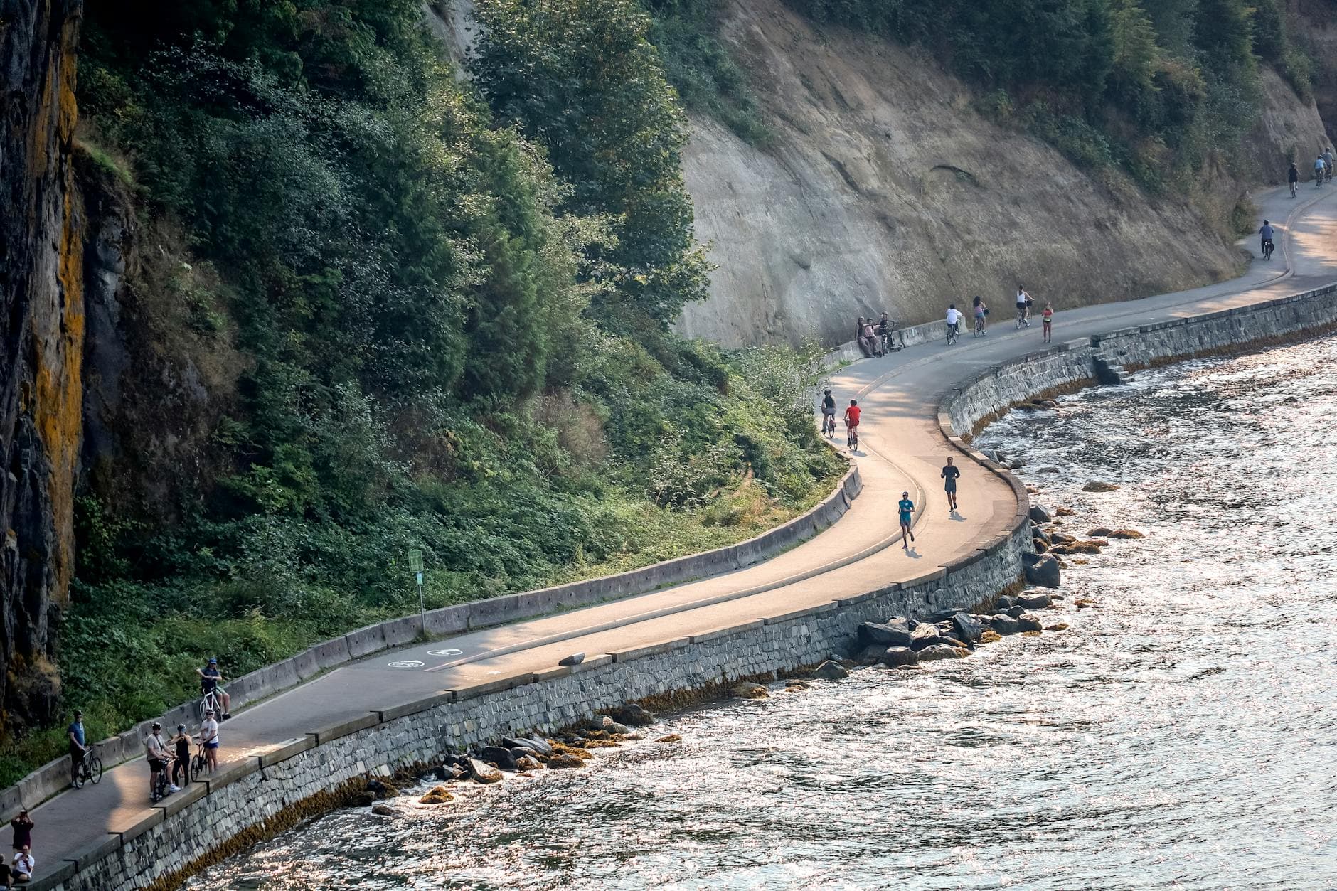 Vancouver seawall path with ocean and mountains