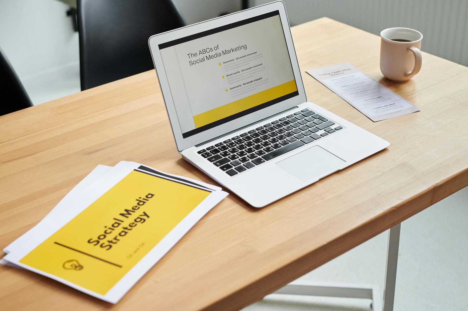 Laptop showing social media marketing strategy documents