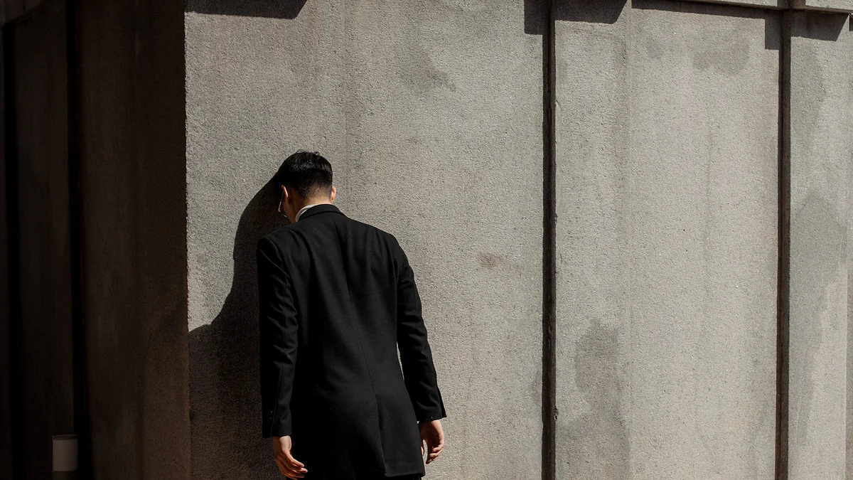 Man Leaning Against The Wall