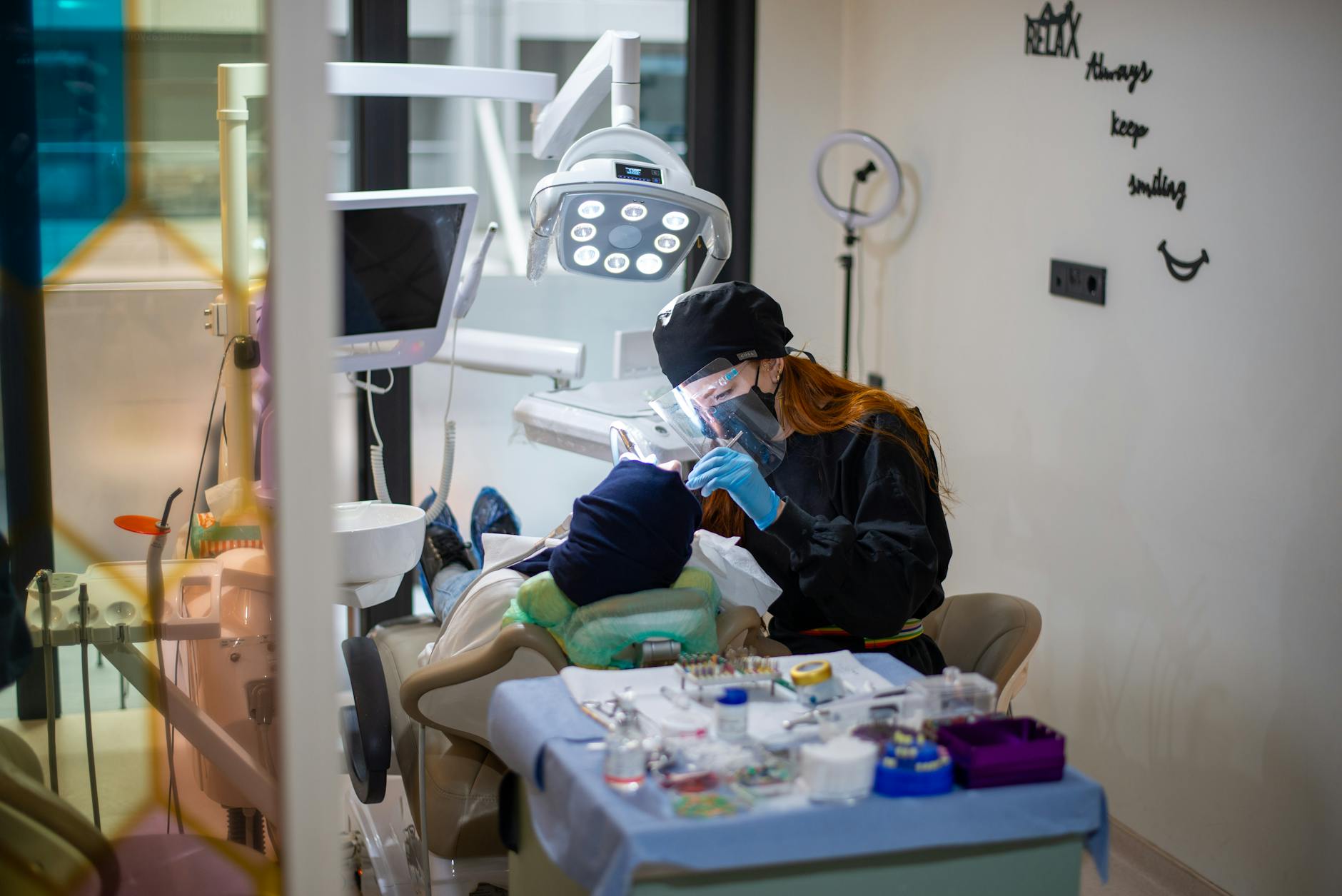 Dentists examining a patient in a modern dental clinic