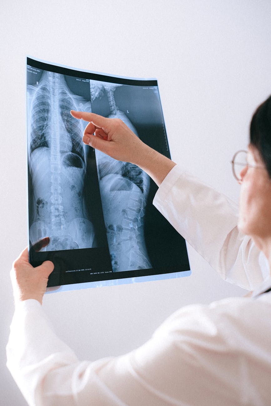 Doctor analyzing a spinal x-ray