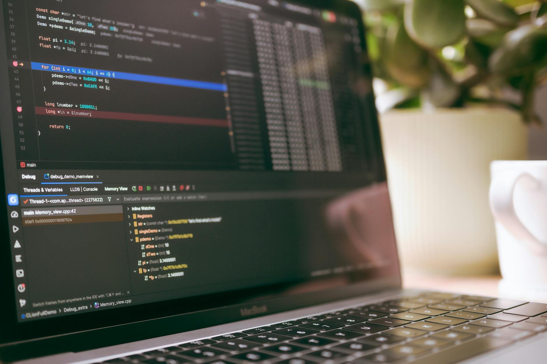 Computer screen showing programming code and debugging tools