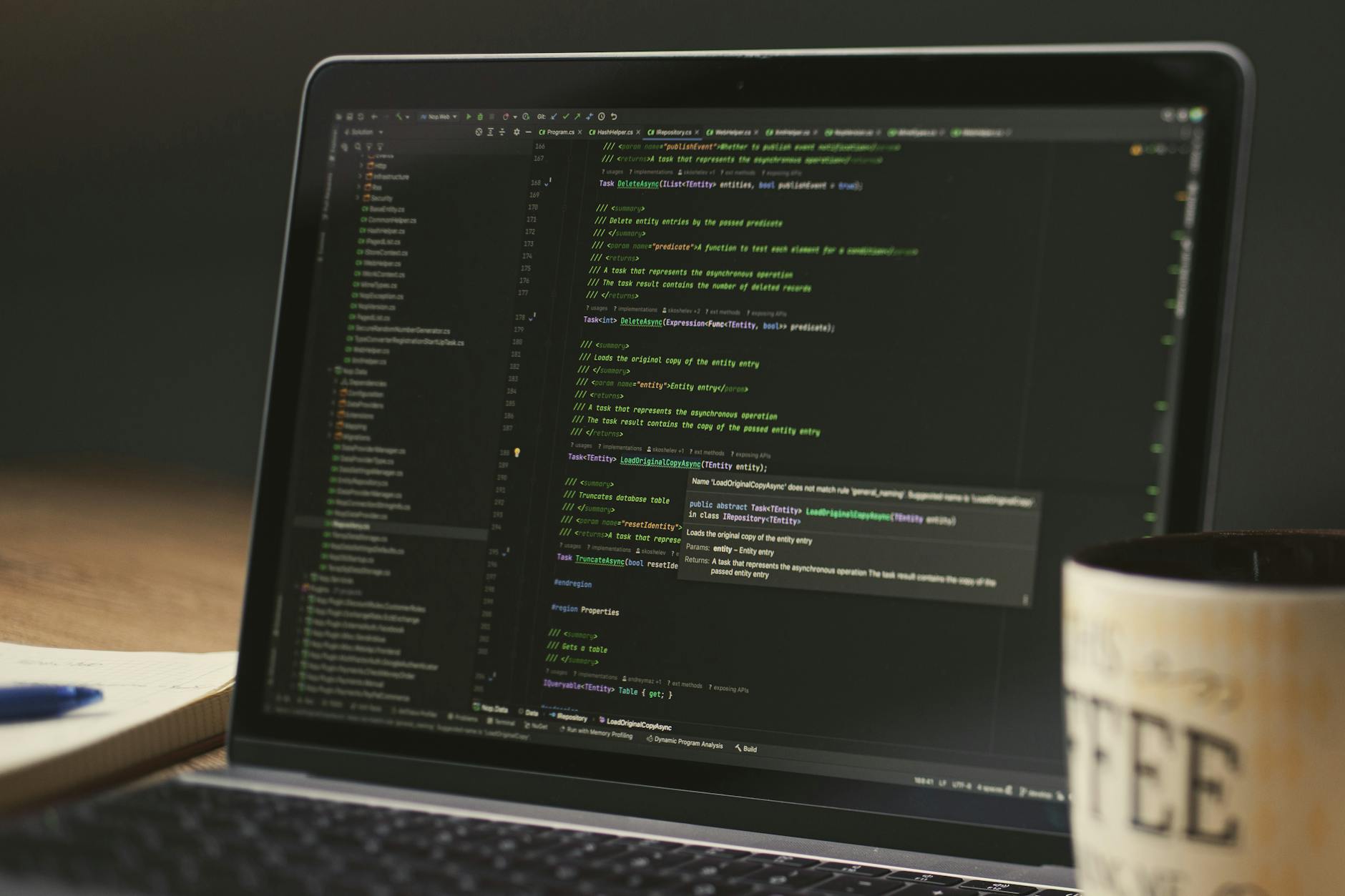 Laptop displaying code in a focused workspace