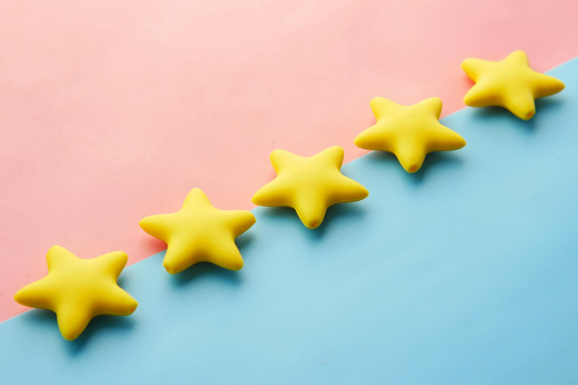 Five-star review symbols on a colorful background