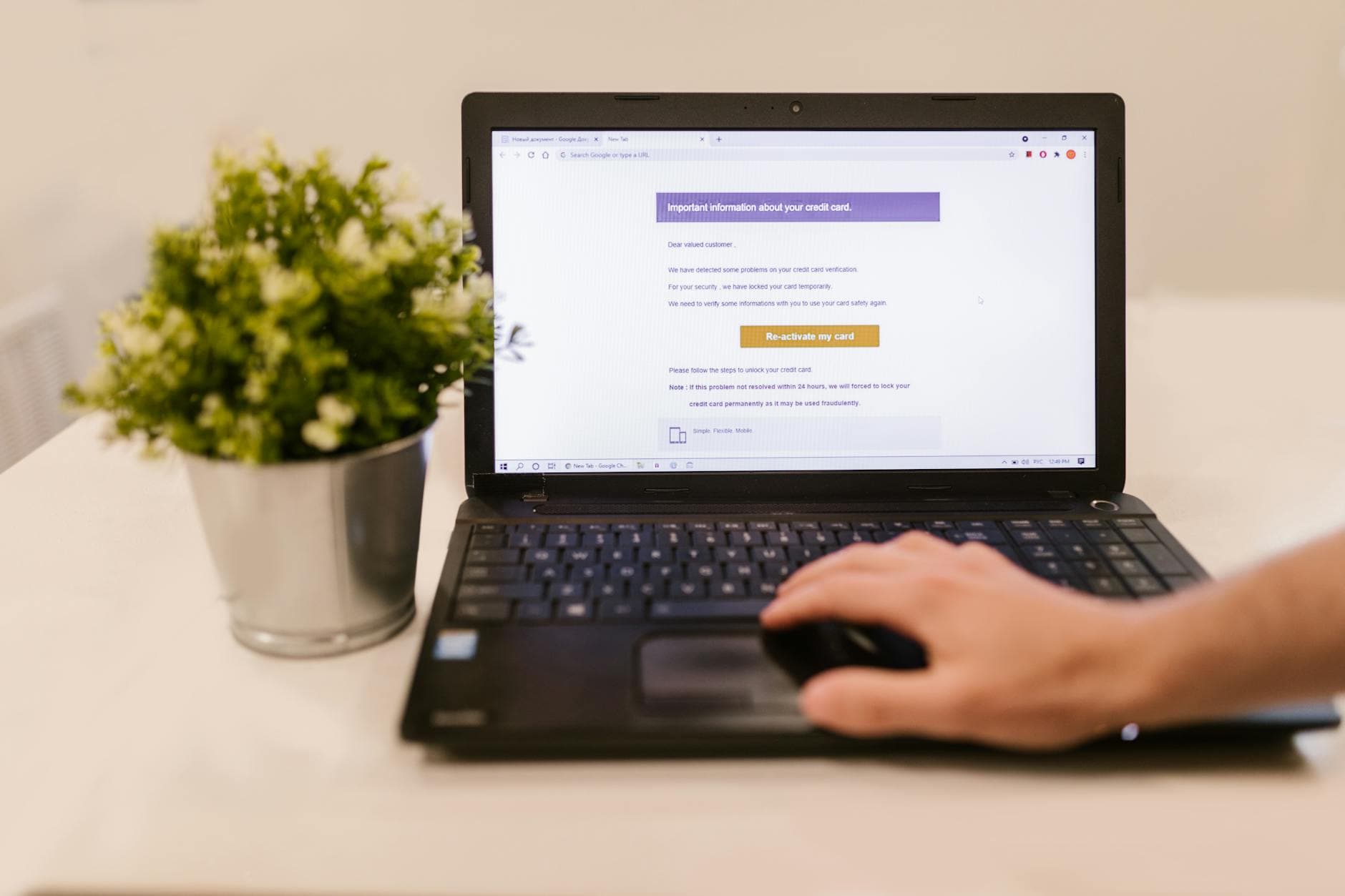 Laptop open to an email inbox on a desk