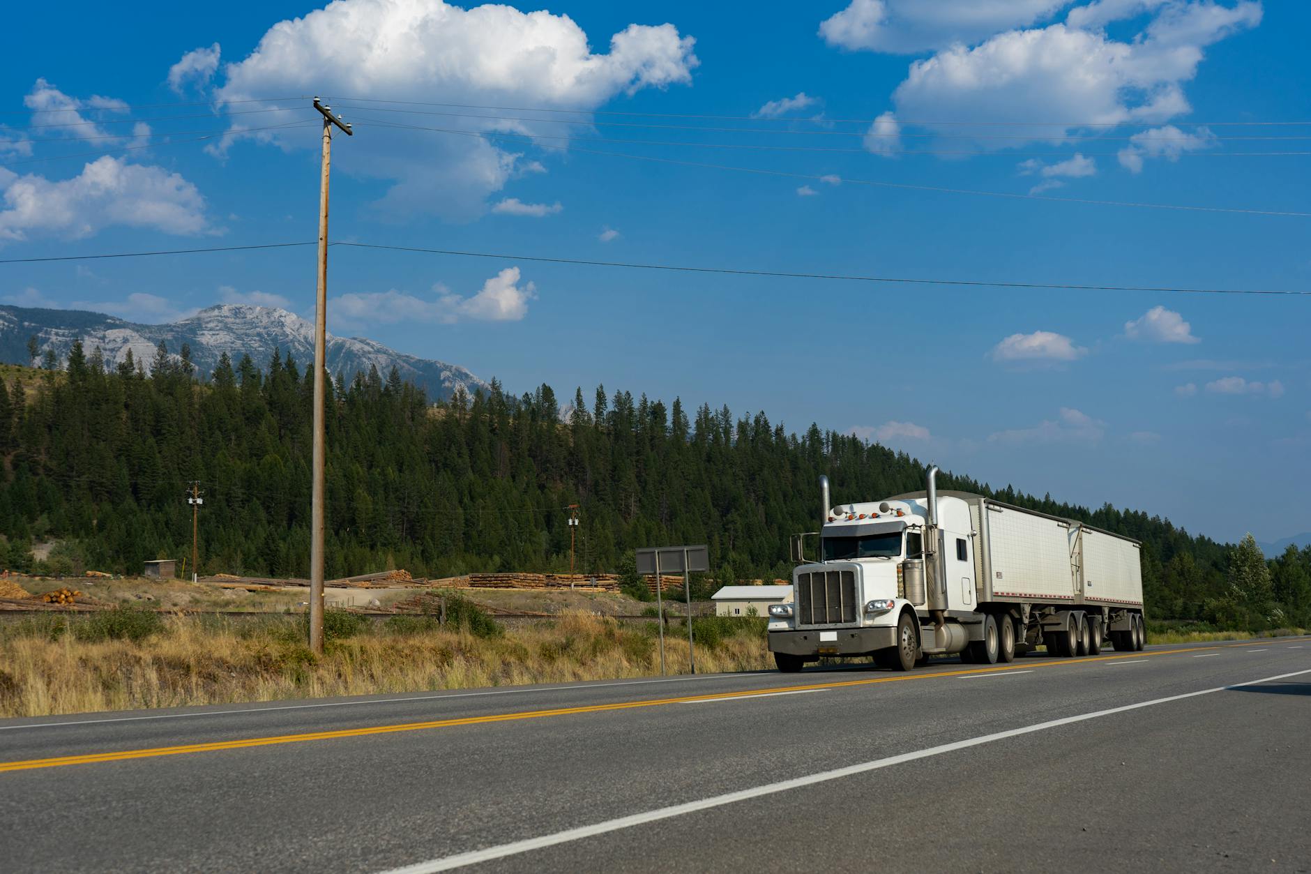 Semi truck driving on a mountain road