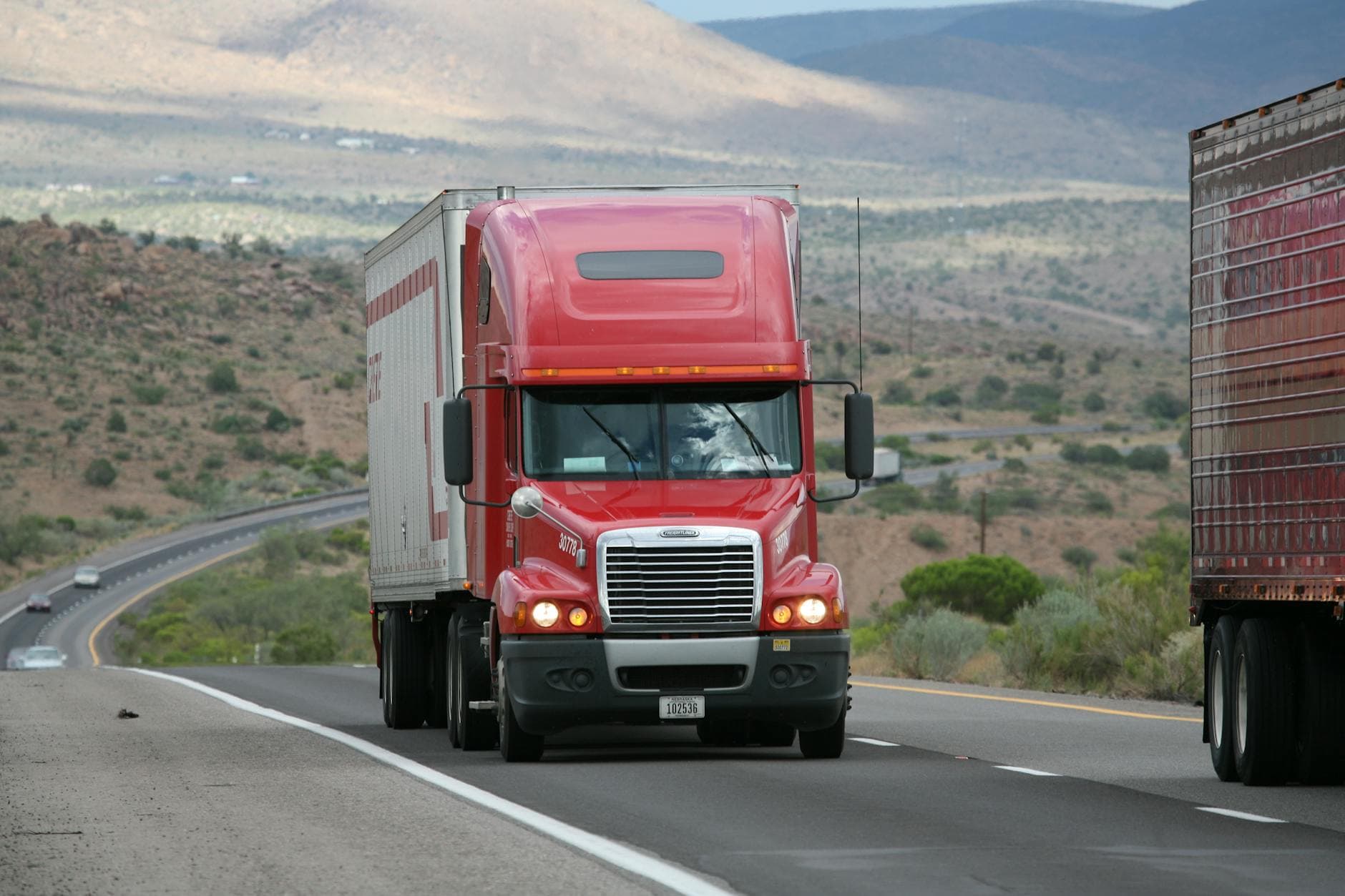 Semi truck driving on a mountain highway