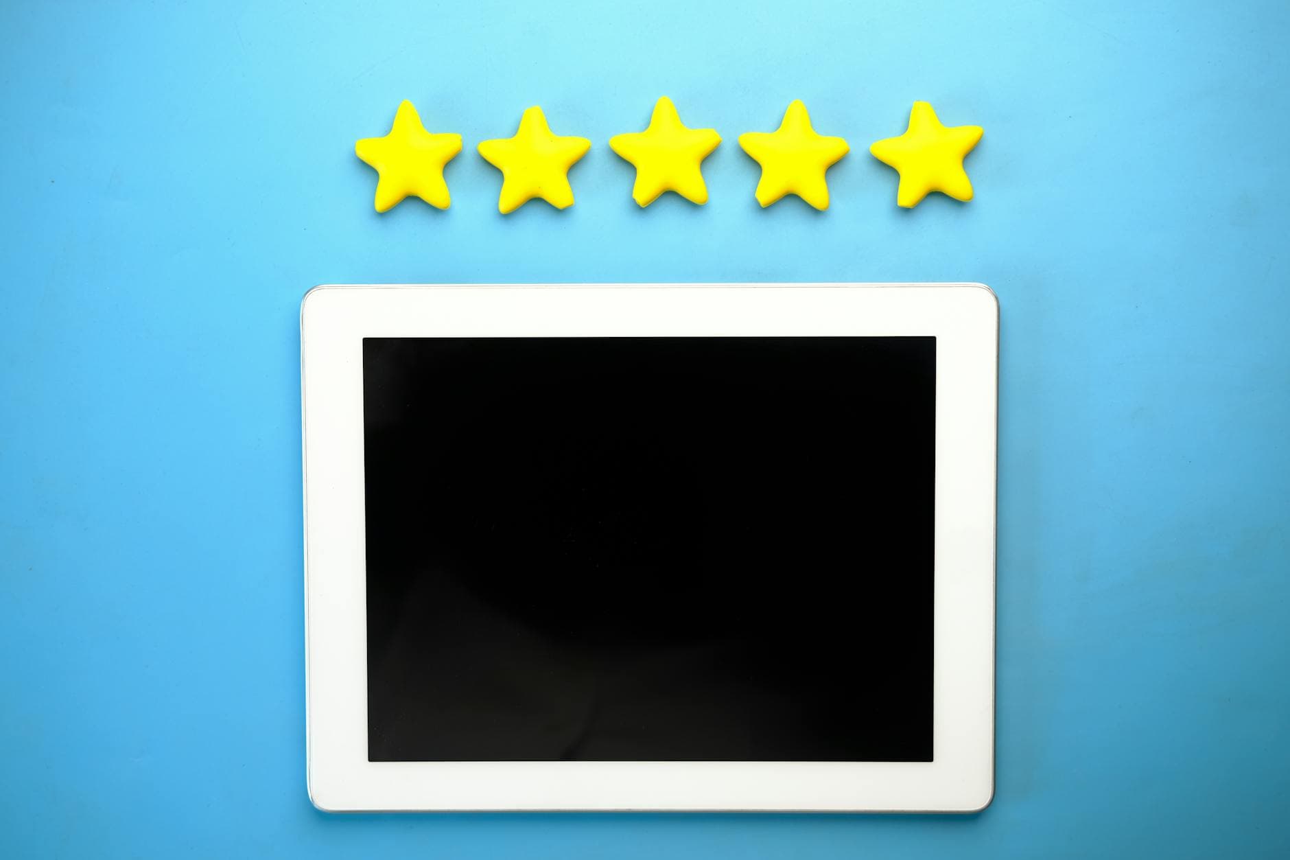 Tablet showing five-star review rating