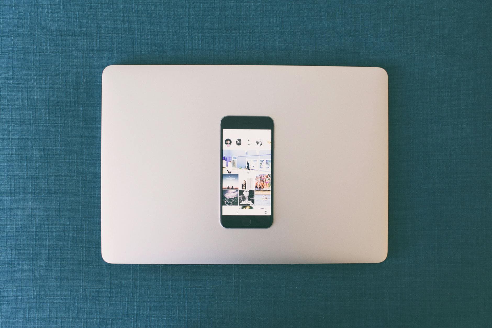 Smartphone and laptop showing social media content